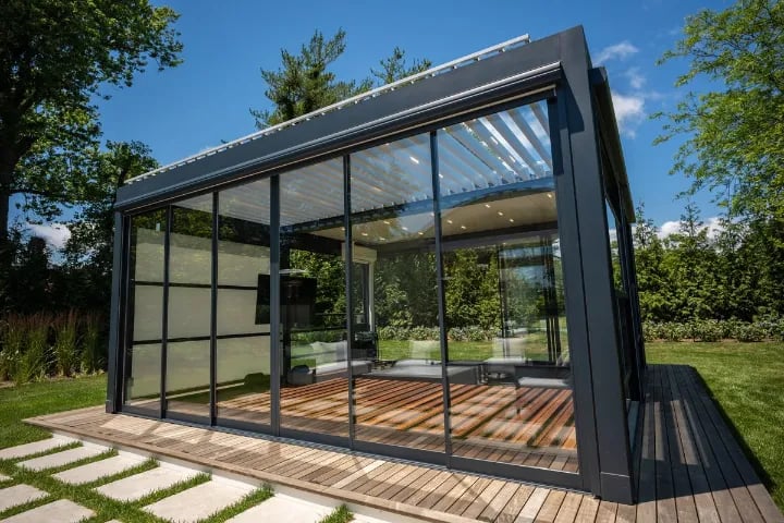 Modern sliding glass door with patio and grass