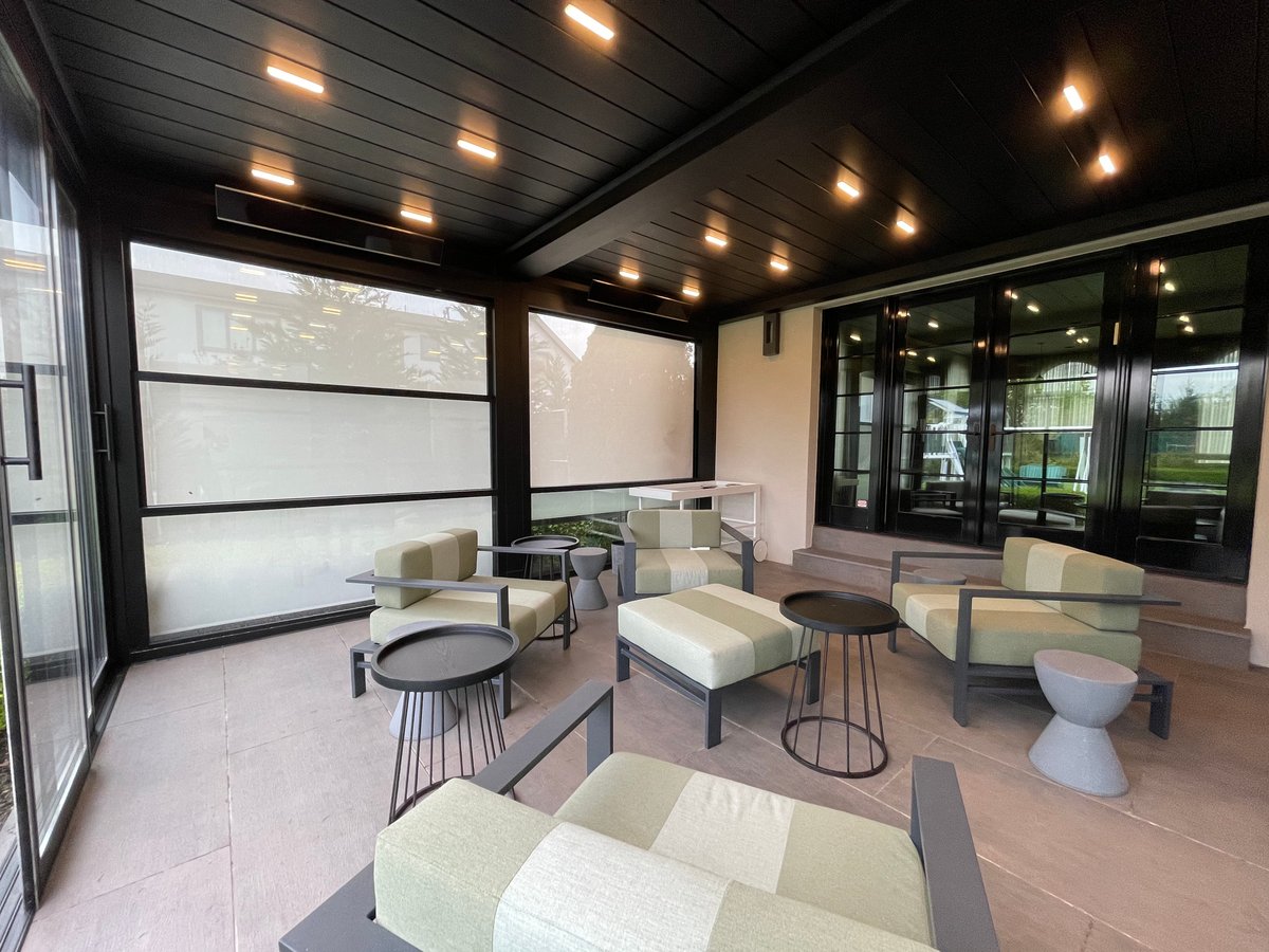 Patio with chairs and tables conveniently located in front of the sliding glass door