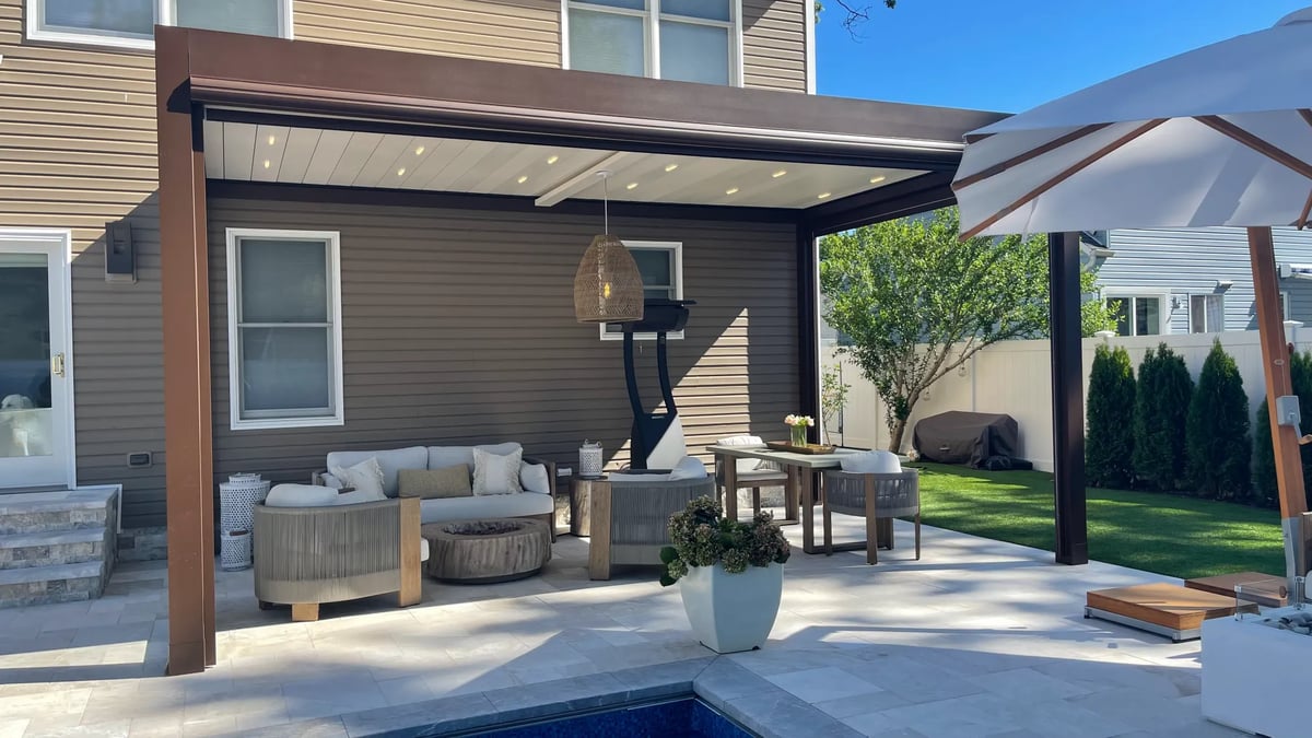 Louvered pergola in the backyard of the house 